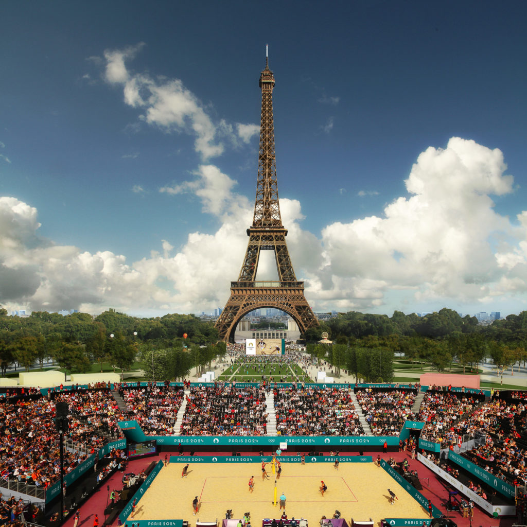 Beach volleyball player playing in front of Eiffel Tower for Paris 2024 Olympic Games